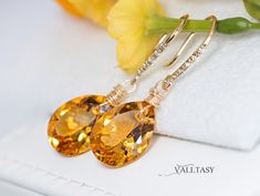 The Sunshine Earrings - Solid Gold 14K Diamond Pear Madeira Citrine Earrings, Genuine Natural Citrine Earrings These earrings are composed of the most amazing genuine, natural Madeira Citrines. The Citrines have the most fantastic warm, golden color. These red-carpet worthy gemstones are absolutely clean and have an intense golden color. They hang from Solid Gold 14k gold unique earwires that are set with 5 diamonds each. ⭐ DETAILS: ✔️ Length including earwires: 1.4″ (about 3.5 cm) ✔️ Gold: All the components are 14K SOLID GOLD (stamped on the earwires) ✔️ Certificate: The Earrings arrive with a Gemstone Authenticity Certificate ✔️ The earwires in the photo are genuine Diamond Earwires: each earring is set with five .5-pt diamonds (I1-I2 grade/H,I color; 2.5 pts. TW) (you can choose to cha Fine Jewelry Citrine Earrings For Wedding, Citrine Fine Jewelry Earrings For Wedding, Citrine Drop Earrings For Wedding, Citrine Wedding Earrings Fine Jewelry, Wedding Fine Jewelry Citrine Earrings, Elegant Citrine Earrings For Wedding, Sunshine Earrings, Drop Earrings Diamond, Citrine Drop Earrings