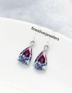 This Earrings Features a 7X10 MM Pear Cut Lab Alexandrite and Sterling Silver Finished with rhodium. Customization is available. It is made by hand, and it will take about 3 to 5 business days to finish the ring after your payment is completed. Product Description Main stone: Lab Alexandrite Metal type: 92.5 Sterling Silver finished with rhodium Accent Stone : Zircon How To take care of This Earrings - Keep the jewelry away from direct heat, water, perfumes, deodorants, and other strong chemical Silver Sterling Silver Pear-shaped Crystal Earrings, Silver Pear-shaped Sterling Silver Crystal Earrings, Sterling Silver Jewelry With Lever Back For Party, Pear-shaped Sterling Silver Crystal Earrings, Silver Pear-shaped Gemstone Earrings, Sterling Silver Pear-shaped Earrings, Silver Pear-shaped Earrings As Gift, Silver Pear-shaped Earrings For Gift, Gift Sterling Silver Pear-shaped Crystal Earrings