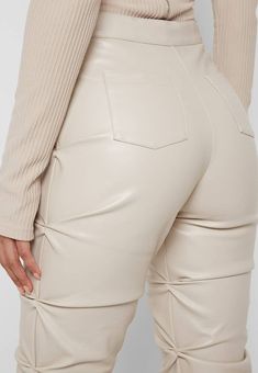 Back in stock! Elevate your wardrobe with our Trinity Faux Leather Pants. These ruched, faux leather pants exude a chic and exclusive vibe, while the fit and flare design flatters your figure. Add a touch of sophistication and luxury to any outfit with these must-have pants. Details: High waist, front zipper, fit and flare, ruched Size Chart: Small: Waist 26, Hip 33, Length 42Medium: Waist 27, Hip 35, Length 43Large: Waist 29, Hip 36, Length 43X-Large: Waist 30, Hip 38, Length 442X-Large: Waist 32, Hip 40, Length 44Model size small 5'8" 36-26-38 Made In: China Fabric Contents: Polyester Bungee Cord, Flare Trousers, Leather Trousers, Faux Leather Pants, Leather Leggings, Vegan Leather, Leather Pants, Pu Leather, Active Wear