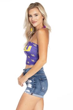 Show off on gameday in the most comfortable LSU Tigers tube top. 100% Polyester. Sublimated design. Made in the USA. Collegiate Summer Tops For Cheerleading, Collegiate Sleeveless Tops For Cheerleading, Summer Sports Fan Tops In Team Colors, Sports Fan Tops For Game Day In Summer, Collegiate Stretch Tops For Sports Events, Casual Purple Game Day Top, Sports Fan Sleeveless Tops For Game Day, Sleeveless Sports Fan Tops For Game Day, Collegiate Style Summer Fan Gear Tops