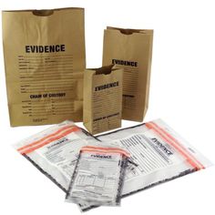 three brown paper bags with evidence labels on the front and two are filled with papers