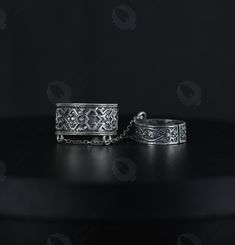 Name: Double Ring Armenian Pattern With Chain | Vintage Ethnic Rings | Antique Style Stackable Rings |Handcrafted 925 Sterling Silver | Adjustable Type: Double Ring Adjustable Metal: Sterling Silver Grade: 925 (a silver alloy of 92.5% purity, harmless for the health and skin) Gift Box: Includes beautiful gift box    Unveil the timeless elegance of tradition with our Double Ring Armenian Pattern With Chain - a vintage-inspired treasure that exudes the rich tapestry of Armenian heritage. Each ring is meticulously handcrafted from 925 sterling silver, ensuring you receive a piece that is not only beautiful but also of the highest quality. The double ring design is connected by a delicate yet sturdy chain, which gracefully adorns your fingers, allowing for movement and flexibility. The adjusta Bohemian Style Engraved Toe Ring Jewelry, Traditional Sterling Silver Ring, Bohemian Engraved Ring With Intricate Design, Bohemian Silver Rings For Ceremonial Occasions, Bohemian Silver Ceremonial Rings, Armenian Pattern, Ethnic Rings, Rings Antique, Silver Jewelry Earrings