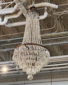 a chandelier hanging from the ceiling in a building