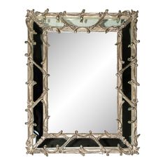 an ornate mirror with black and white accents