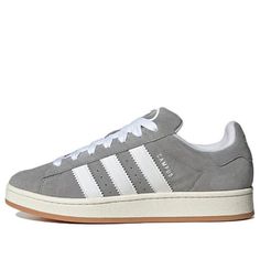 The adidas Campus 00s Grey White sneaker, model HQ8707, features a stylish blend of grey and white. The upper is constructed with suede for both durability and style. The subtle pattern on the shoe adds a touch of uniqueness. Whether you’re hitting the streets or just want a comfortable and fashionable shoe, the adidas Campus 00s is a great choice. (SNKR/Cozy/Skate/Light/Unisex/Low Top/Non-Slip/Wear-resistant) Popular Women Shoes, Gray Campus 00s, Grey Adidas Campus 00s, Grey Campus 00s, Grey Adidas Campus, Addidas Shoes Campus 00s, Addidas Shoes Campus 00s Outfit, Adidas Campus 00s Grey, Addias Shoes