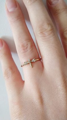 "14K 9K Dragonfly Diamond Ring, Dainty Dragonfly ring, Libellule Insect Animal Ring, Dainty Stacking Gold ring, Minimalist Diamond ring, Gift for her, FREE EXPRESS SHIPPING Delicate, minimalist dragonfly ring made in 14K solid gold and set with white diamonds. Wear it by itself or stack it with your other dainty bands and rings. In almost every part of the world, the Dragonfly symbolizes change, transformation, adaptability, and self-realization. The change that is often referred to has its sour Minimalist Diamond Rings, Custom Bar Necklace, Dragonfly Ring, Animal Ring, Dainty Band, Diamond Evil Eye, Types Of Gold, Gold Designs, Evil Eye Ring