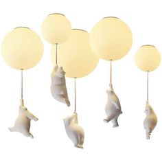 three polar bear mobiles hanging from the ceiling