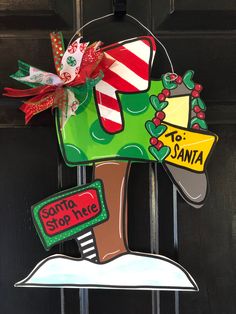 a door hanger that has some christmas decorations on it