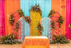 a decorated stage with flowers and decorations