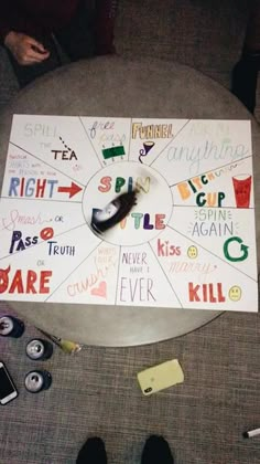 a game board sitting on top of a table next to some other items and papers