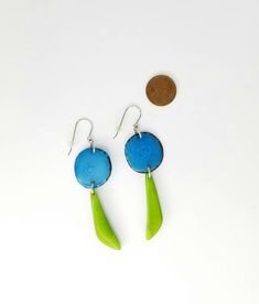 "These very light earrings in turquoise blue and lawn green are a breeze to wear. Lots of movement and a splash of color from these natural tagua beauties! The earrings are long. Each pair is a little different but on average they measure 2 3/4\"." Unique Green Nickel-free Earrings, Unique Blue Hypoallergenic Earrings, Unique Hypoallergenic Turquoise Earrings, Distinctive Hypoallergenic Turquoise Earrings, Hypoallergenic Turquoise Earrings, Unique Green Teardrop Earrings, 14th Anniversary Gifts, Tagua Nuts, Light Earrings