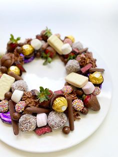 a white plate topped with lots of different types of candies on top of it