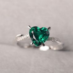 ◆ The ring is handcrafted from sterling silver and decorated with a dazzling 8*8 mm Lab Grown Emerald and CZs. It is suitable for engagement/anniversary/daily occasion. ◆ Production Description: Main stone Type: Lab Grown Emerald Main Stone Shape: Heart Cut Main Stone Size: 8*8 mm(1.59ct) Side stone: CZ Metal: 925 Sterling silver - Other options available in the drop down menu ◆ Customization: √Free for Add Engraving √Other Metal Type Available √Other Gemstones & Shapes Available √Personaliz Moissanite Heart Cut Diamond Ring For Proposal, Heart Cut Moissanite Diamond Ring For Proposal, Green Diamond Heart Cut Ring, Heart-shaped Emerald Rings For Wedding, Heart-shaped Diamond Birthstone Ring, Elegant Heart-shaped Emerald Ring For Anniversary, Fine Jewelry Heart Cut Diamond Ring With Gemstone, Diamond Heart-shaped Birthstone Ring In White Gold, Silver Diamond Birthstone Ring For Proposal