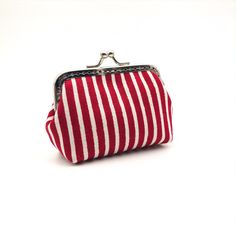 THIS Handmade Kiss Lock Coin Purse is made from High Quality Japanese Cotton fabric with Red Striped. It is great for storing your coins, keys, headphone or little accessories when you go out. Therefore, this is an awesome gift for your Friends and Family members. MATERIAL: - A Kiss Lock Purse Frame (8.5cm) - High Quality Japanese Cotton fabric with Red Striped SIZE: 10cm x 7cm (including the frame) SHIPPING: All the products will be delivered within 7 working days when the payment was confirmed. And your purchased items will be sent out by e-Express service provided by Hong Kong Post. It may take 7 to 14 working days for mail items to reach recipients for most destination cities which are subject to situation of flight availability, customs clearance. We will provide the essential online Kiss Lock Purse, Clasp Purse, Fabric Red, Wallet Pouch, Striped Fabric, Japanese Cotton, Thanksgiving Gift, Gift For Mother, Japanese Fabric