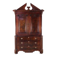 an antique wooden armoire with two doors and drawers on one side, inlaid to the other