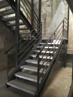 a metal stair case in an old building