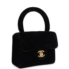 This Vintage Micro Kelly Flap Bag is in black velvet leather with gold hardware, a front flap with signature CC turnlock, a rear half moon pocket, and a black velvet top handle.The interior is lined with black leather and has one slip pocket.Collection: 3-series (1994-1996)Origin: FranceCondition: Vintage; Excellent - The bag retains its shape. No plastic on the hardware. There's visible scratches to the hardware. The top handle is a little loose. The exterior fabric has some wear around the corners, the top handle, and back of bag. The interior leather has scratches and scuffing to the leather. The date stamp sticker is slightly faded but still legible and intact.Accompanied by: Chanel dustbag and COA cardMeasurements: 5.5" width x 4.5" height x 2.5" depth; 3.25" handle drop Black Velvet Rectangular Bag, Black Velvet Rectangular Bags, Black Rectangular Velvet Bags, Luxury Velvet Shoulder Bag For Formal Occasions, Black Velvet Top, Date Stamp, Hermes Birkin 25, Kelly Bag, Birkin 25