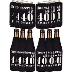 six black and white beer bottles with numbers on the front, four are labeled 40 years and forty years