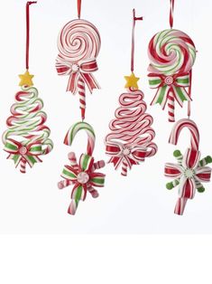 candy canes and christmas decorations hanging from strings