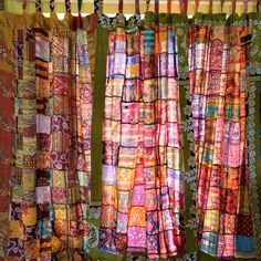 the curtains are covered with colorful fabric