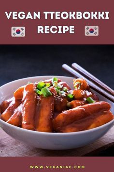 a white bowl filled with meat covered in sauce next to chopsticks on top of a wooden table