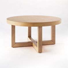 a round wooden table with two legs on the bottom and one leg in the middle