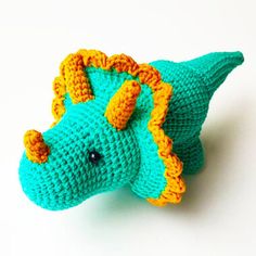 a crocheted stuffed animal that looks like a dinosaur