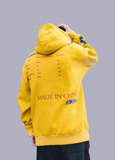 Radiate confidence in this vibrant urban yellow hoodie. Experience the Yellow Streetwear Hoodie, a daring fusion of fashion tailored for today's audacious and discerning youth. Imagine yourself navigating the urban jungle, your radiant yellow attire reflecting the golden summer sun, an absolute head-turner amidst the monochromatic cityscape. This distinguished yellow graphic hoodie for men will undoubtedly become your hallmark, instantly distinguishing you from the mundane. Every element of this yellow streetwear outfit resonates with audacity and individuality. The sun-bright yellow commands attention and admiration, creating a visual spectacle for those fortunate enough to witness. It bears a spectacular array of Chinese and Japanese Kanji letterings adorning its expanse, injecting a spl Yellow Streetwear Outfit, Monochromatic Cityscape, Apocalyptic Clothing, Golden Summer, Yellow Streetwear, Techwear Pants, Radiate Confidence, Streetwear Hoodie, Japanese Kanji