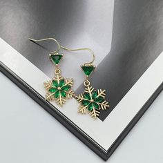 Green Statement Earrings, Snowflake Drop Earrings, Snowflake Earrings, Crystal Earrings, Emerald Green Earrings, Winter Christmas Earrings. These cute gold plated over brass crystal snowflakes earrings hang from gold plated French hook ear wires. Simple yet adorable, these earrings are great accessories for winter. The Earrings made from gold plated supplies and made very firmly and gently, without using any glue. Snowflake Earrings are lightweight and very comfortable to wear. Measurement: The Gold Earrings For Holiday And New Year, Gold Earrings For New Year Holiday, Holiday Winter Drop Earrings, Winter Holiday Drop Earrings, Gold Holiday Drop Earrings, Winter Gift Drop Earrings, Christmas Gift Crystal Dangle Earrings, Christmas Gift Dangle Crystal Earrings, Gold Jewelry For Winter Party