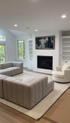 a living room with two couches and a fireplace