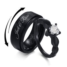 two black wedding rings with an engraved diamond