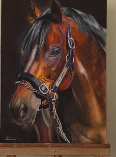 a painting of a brown horse on a easel