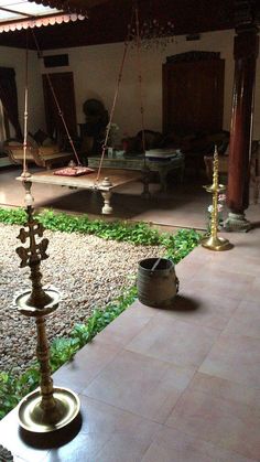 an outdoor area with swings and candles on the ground