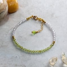 Peridot and Cubic Zirconia bracelet handcrafted using 3mm AAA faceted Peridot beads, 3mm AAA faceted Cubic Zirconia beads, 2mm gold  fill beads and fastened using a gold plated lobster claw clasp and 25mm extension chain for an adjustable fit. Peridot is one of the birthstones for August and would make a charming birthday gift. Peridot is the 16th anniversary gift on modern anniversary gift lists and this bracelet would make the perfect gift as a token of love. Peridot is known as the stone of c Faceted Beads Bracelets As May Birthstone Gift, May Birthstone Bracelets With Faceted Beads As Gift, Faceted Beads Bracelet For May Birthstone Gift, Faceted Round Bead Bracelets For May Birthstone, Faceted Round Beads Bracelet For May Birthstone, Faceted Rondelle Crystal Bracelet Gift, May Birthstone Faceted Beads Bracelet, Peridot Bracelet Gemstones, Adjustable Peridot Bracelets For Gifts