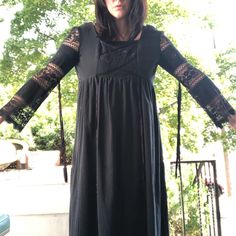 Vintage 1970s Rags by Kressandra  black cotton crepe black magic  witchy women ️ maxi dress with ribbons hanging and lace long sleeve  Excellent vintage condition with no flaws found  Measurements taken laying flat  Shoulders 14  Chest 34  Waist 29  Hips open  Length 53  #witchy #halloween #1970s #black #dress Fall Lace Patchwork Maxi Dress, Spring Black Maxi Dress With Lace Patchwork, Black Maxi Dress With Lace Patchwork For Spring, Black Lace Patchwork Maxi Dress For Spring, Fall Maxi Dress With Lace Trim, Black Bohemian Maxi Dress With Lace Trim, Maxi Dress With Lace Trim For Fall, Lace Trim Maxi Dress For Fall, Black Long Sleeve Maxi Dress With Lace Patchwork