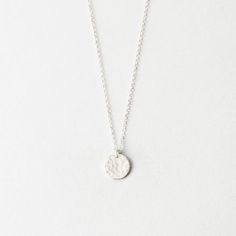 Our small 9mm disk pendant, offered with a smooth or hammered finish. Everyday Hammered Coin Necklace With Round Pendant, Minimalist Hammered Coin Necklace As Gift, Hammered Medallion Coin Necklace In Sterling Silver, Minimalist Hammered Coin Necklace Gift, Everyday Minimalist Hammered Coin Necklace, Minimalist Hammered Pendant Charm Necklaces, Minimalist Hammered Round Coin Necklace, Hammered Round Coin Necklace, Minimalist Hammered Coin Necklace