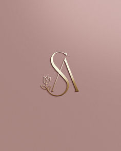 the letter s is made up of gold foil and has a flower on it's side