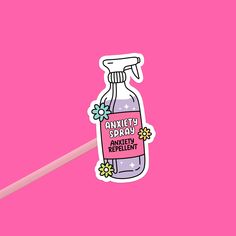 a pink background with an image of a bottle of sanitizer and a pencil