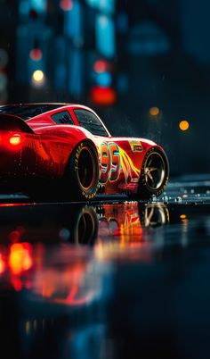 a red sports car with flames painted on it's side in the rain at night