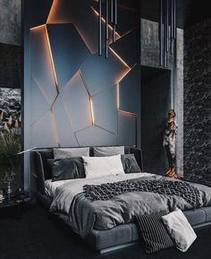 a modern bedroom with black and grey walls, an abstract wallpaper and a large bed