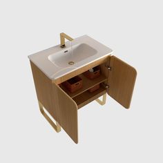 a bathroom sink sitting under a wooden cabinet