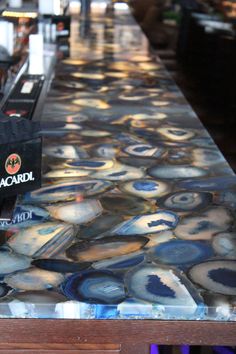 the counter top is made out of agate glass and has an interesting pattern on it