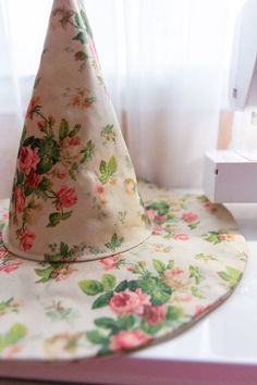 a flowered hat sitting on top of a table