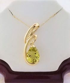 "Peridot pendant with chain. Details: Weight: 2.5 grams Primary stone: Peridot Shape: Pear Chain Length: 18\" Metal: 14k Yellow Gold Condition: Brand new! PACKAGING: Each item comes in a jewelry box and wrapped beautifully as a gift. If you would like us to include a gift note in the parcel, please leave us a message with your order about the content of the note. We would love to prepare for you. CUSTOM ORDERS: We welcome all kinds of custom orders. Please reach out to us for any information you Peridot Pendant, Chain Lengths, Online Jewelry, Precious Metals, Jewelry Box, Gold Necklace, Jewelry Necklace Pendant, Yellow Gold, Jewelry Necklaces