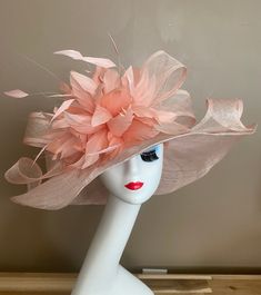 "Pale Pink Wide brim sinamay hat with sinamay bow and stunning feather flower, elegant, light and comfortable to wear. Head size is about 22.5\" unless otherwise requested. All hats include a sizing band to adjust for a comfortable fit.  Key Features: Wide brim Appr: 6-6.5\" Head Grith Appr: 22.5\" and adjustable to fit sizes smaller than 22.5\" Crown Deep Appr: 4.5\" Processing Time: 1-3 business days Warm tips:  ❤️Group discount on 3 or more pieces, please contact me for further information on Easter Wedding, Bow Light, Sinamay Hats, Wedding Tea, Derby Day, Kentucky Derby Hat, Feather Flower, Derby Hat, Pink Feathers