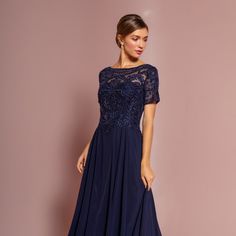 The Charming Dress Made In A-Line Silhouette Has A Delicate Top Decorated With Delicate Lace, Which Together With A Small Number Of Rhinestones Will Create A Romantic Image. Fabric: Chiffon Length: Long Colour: Navy Neckline: Boat Neck Silhouette: A-Line Sleeve: Cap Sleeve Back: Zipper Skirt: Layered Embellishments: Lace Occasion: Romantic Date/Evening/Dinner, Wedding/Bridesmaid, Graduation, Fashion Show, Visiting Theater/Museum/Restaurant, Banquet, Photo Shoot, Concert, Ball Gown Tags: Boat Nec Short Sleeve Dress With Lace Bodice For Gala, Blue Evening Dress With Lace Bodice, Blue Lace Bodice Dress For Evening, Blue Chiffon Formal Dress With Short Sleeves, Blue Chiffon Evening Dress For Mother Of The Bride, Blue Embellished Chiffon Dress, Museum Restaurant, Graduation Fashion, Dress With Cap Sleeves