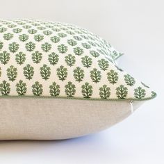 a close up of a pillow on a white surface