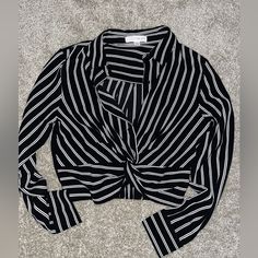 Crop-Style Long-Sleeve Top. Never Worn. Black And White Stripes With A Twist In The Front Smoke-Free & Pet-Free Home Trendy Black Blouse For Office Wear, Black Long Sleeve Shirt For Day Out, Elegant Black Shirt For Day Out, Black And White Long Sleeve Tops For Fall, Chic Striped Tops For Night Out, Black Long Sleeve Tops For Office, Black Long Sleeve Office Tops, Casual Black And White Tops For Work, Black And White Tops For Workwear In Spring