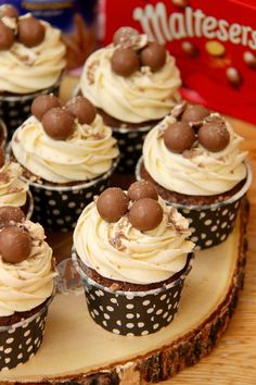 cupcakes with white frosting and chocolate sprinkles