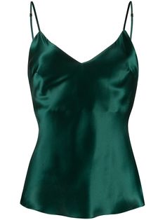 Emerald green Sophia silk top from GILDA & PEARL featuring V-neck, spaghetti straps, open back and straight hem. POSITIVELY CONSCIOUS: GILDA & PEARL scores 3 out 5 by independent ethical brand rating agency Good On You. It has a good animal rating and does not use fur, leather, wool, down, exotic animal skin or angora. It traces most of its supply chain manufacturers locally to reduce its carbon footprint. | Gilda and Pearl Sophia silk top Emerald Clothes, Emerald Green Top Outfit, Emerald Green Clothes, Emerald Green Fashion, Emerald Green Shirt, Emerald Green Outfit, Emerald Green Top, Green Silk Top, Dark Green Top